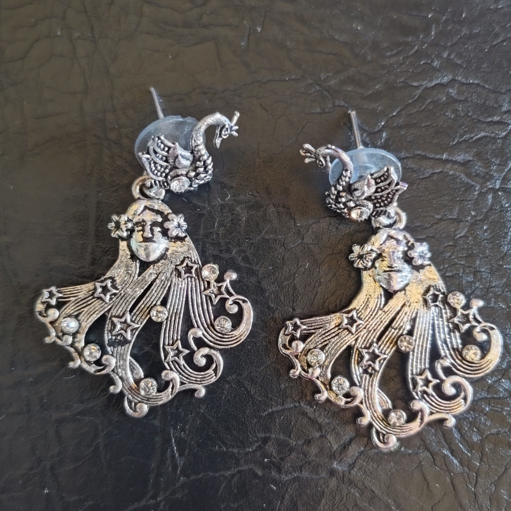 Silver Earrings with Animal Motif and Intricate Swirls